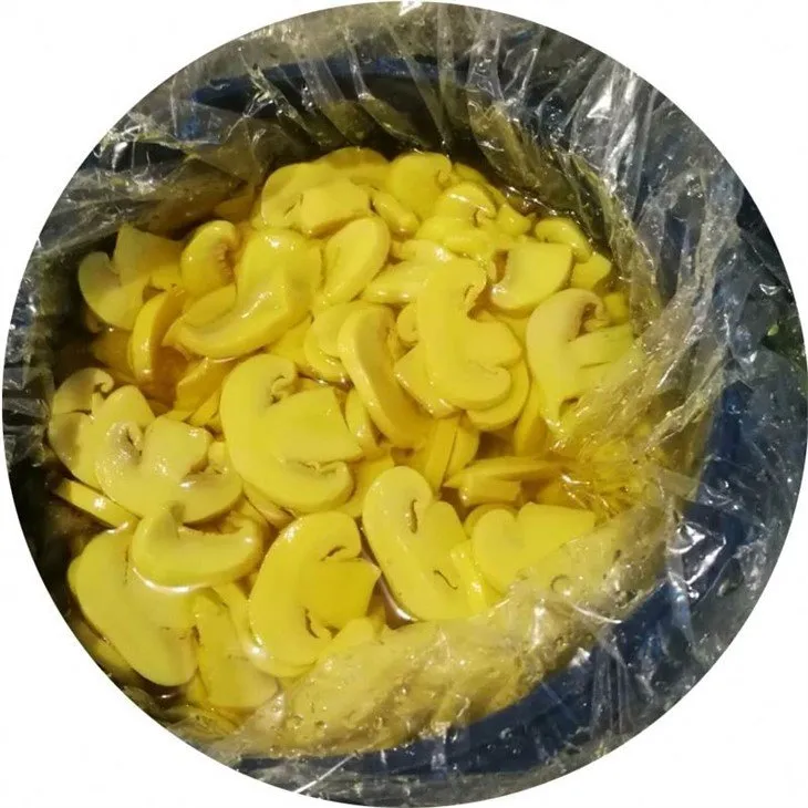 Sliced mushroom in brine in drums